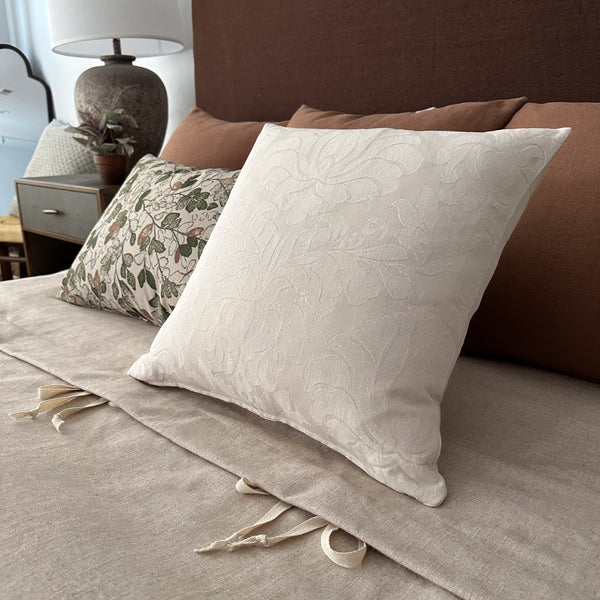 white color and subtle damask pattern make this pillow cover a versatile choice for any interior style