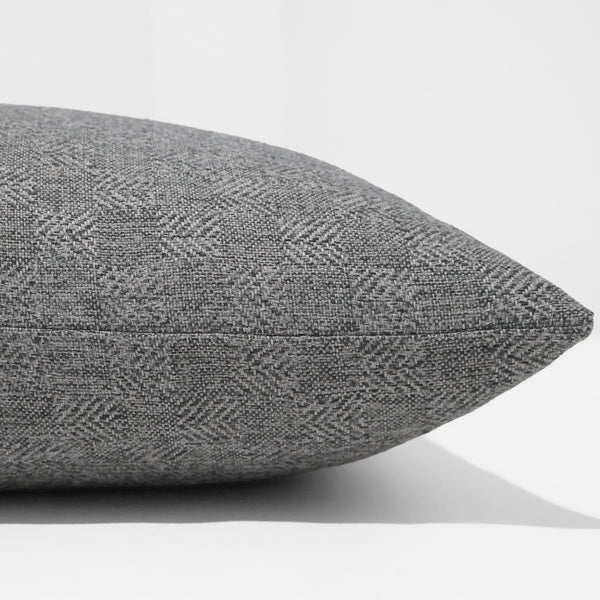 Slate Timber Pillow Cover in textured slate gray performance upholstery fabric featuring a subtle woven herringbone geometric pattern, handmade by Hackner Home. Side View of cushion cover