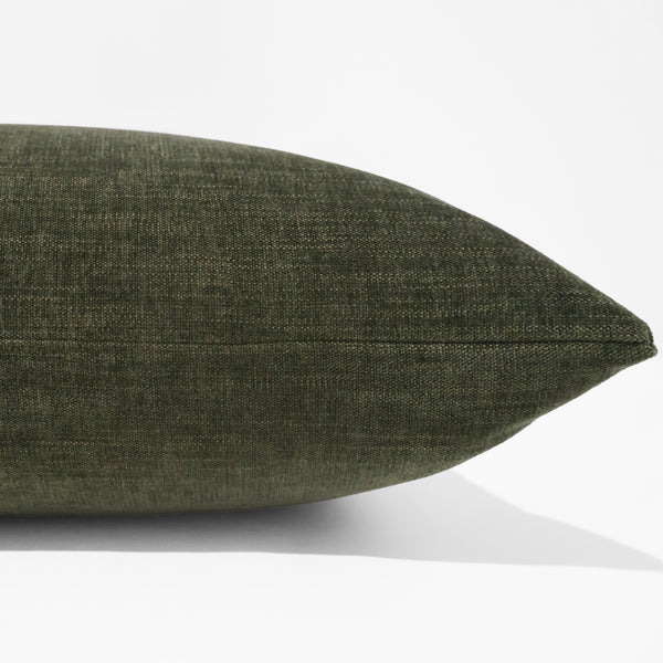 Laurel velvet pillow cover with soft heathered texture in deep olive green, front corner detail