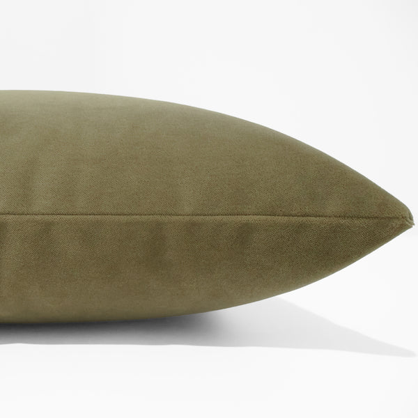 Side view of olive green velvet pillow cover showing clean flat seam and fine, even velvet pile