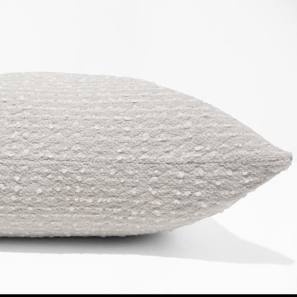 Oatmeal boucle pillow cover with nubby textured weave, front corner detail