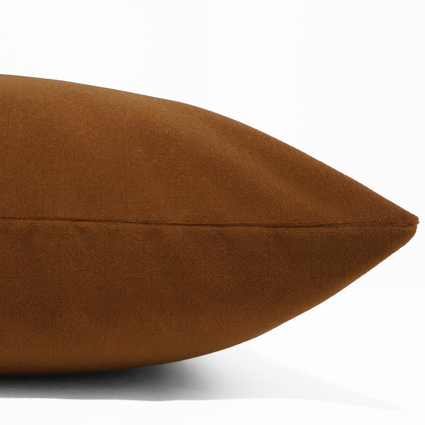 Cinnamon velveteen pillow cover with smooth matte finish, front corner detail