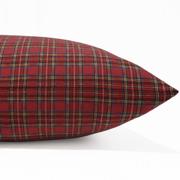 Side view of cranberry red tartan pillow cover showing flat seam and soft woven cotton texture.