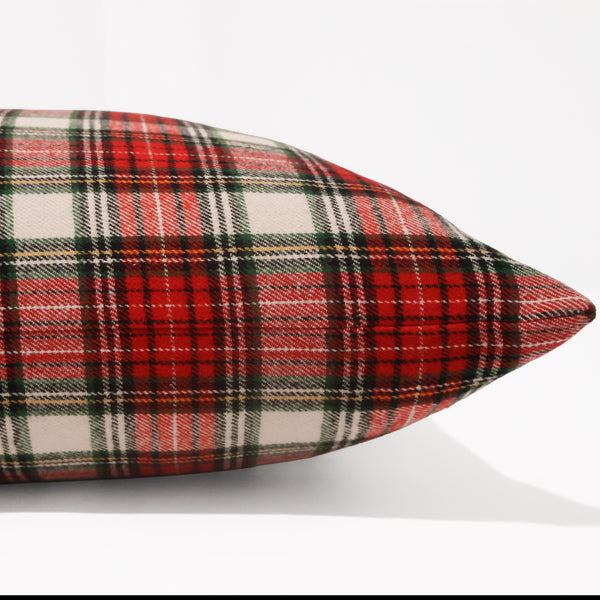 Side view of red and ivory tartan pillow cover showing flat seam and soft woven cotton twill texture