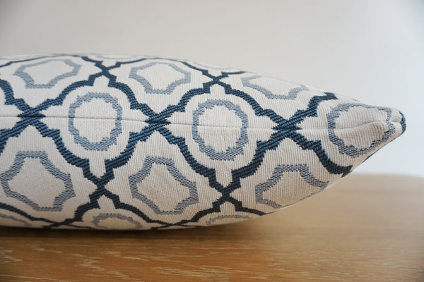 Blue Mosaic Indoor/Outdoor Lumbar Pillow Cover featuring a blue and ivory geometric trellis pattern, handmade by Hackner Home for coastal patios and designer interiors.
