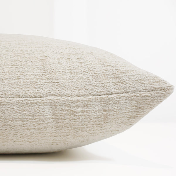 Chalkstone Weave Indoor/Outdoor Pillow Cover in warm ivory textured performance fabric, luxury woven decorative throw pillow cover handmade by Hackner Home for modern coastal, organic, transitional, and outdoor living spaces. Side View of cushion cover.