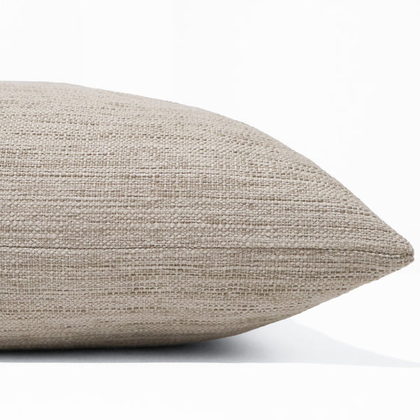 Dune Weave Pillow Cover in oatmeal beige indoor performance fabric featuring a refined linen-inspired texture and tailored designer styling. Side view of Pillow Cover
