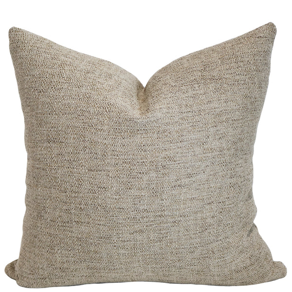 Gold Kissed woven indoor/outdoor pillow cover in warm beige performance fabric for coastal living rooms, patios, bedrooms, and luxury home decor.