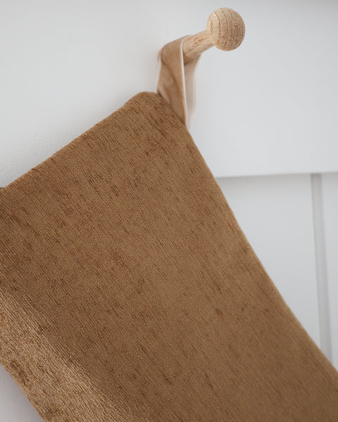 Close-up of the fine caramel slub weave on the Praline Textured Large Minimal Christmas Stocking.
