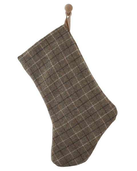 Boho Design plaid wool Christmas stocking with a rounded foot in deep green with a sand velvet hanging loop, shown on a white background