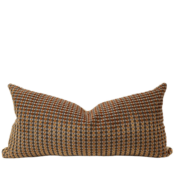 A rectangular lumbar throw pillow with a textured, woven geometric pattern in brown, beige, and black, shown against a plain white background.