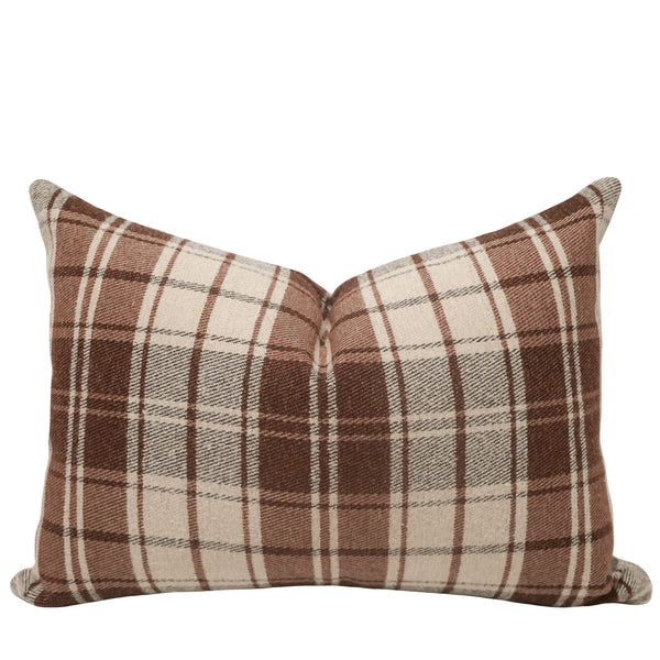 Close-up of hickory plaid fabric showing woven twill texture and layered brown stripes