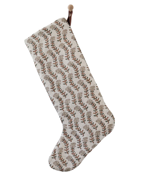 Large Design linen block print Christmas stocking with a long leg, curving botanical stem pattern in brown and sage and a rust velvet hanging loop, shown on a white background