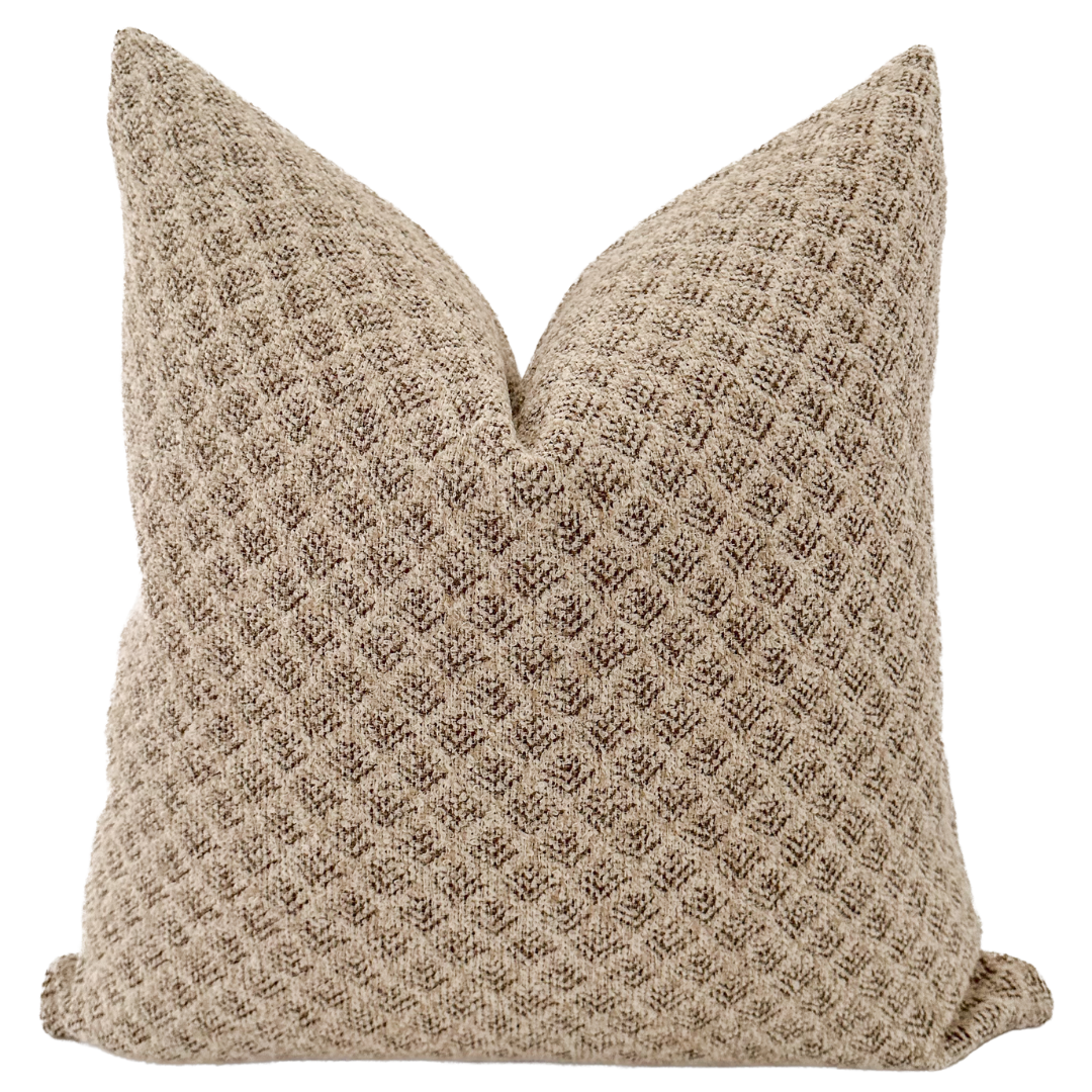 Whether placed on a sofa, chair, or bed, the Lolo Rossa pillow cover becomes a focal point, seamlessly blending with various color schemes and decor styles. Its light brown tone provides a neutral backdrop, allowing for easy integration into existing design elements.