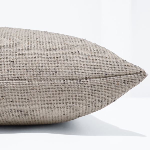 Loom & Linen Pillow Cover in textured oatmeal and ivory woven upholstery fabric with subtle charcoal flecks, handcrafted by Hackner Home for luxury modern organic and transitional interiors. Side View of cushion cover. 