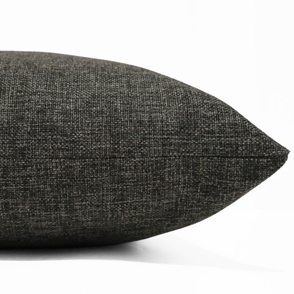 Raven Weave Pillow Cover in rich charcoal-black textured performance upholstery fabric with a woven linen appearance, handcrafted by Hackner Home for luxury modern organic and contemporary interiors. Side view of Cushion cover.
