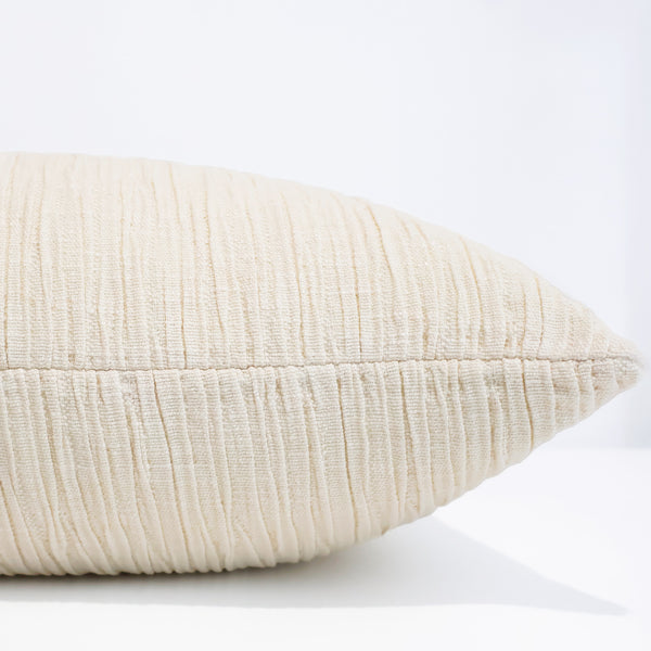 Softly Gathered ivory textured pillow cover featuring elegant horizontal pleated upholstery fabric, handmade by Hackner Home for luxury modern home décor. Side view of cushion cover.