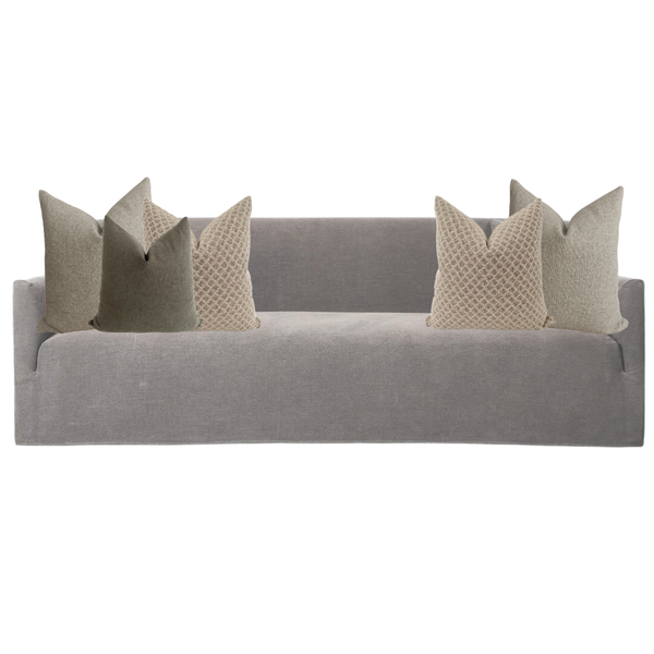 Gray sofa with decorative pillows on a white background