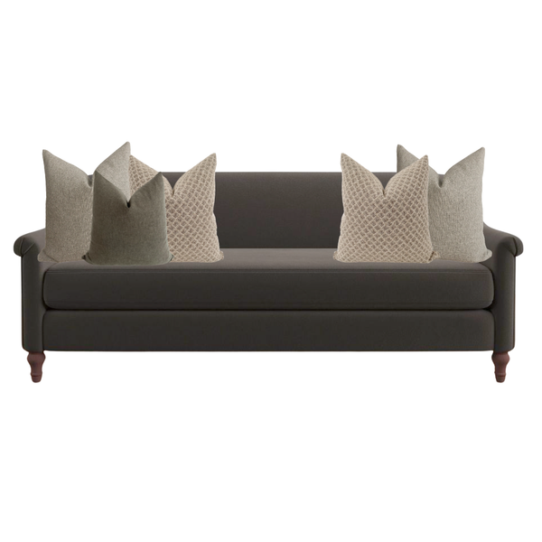 Gray sofa with decorative pillows on a white background