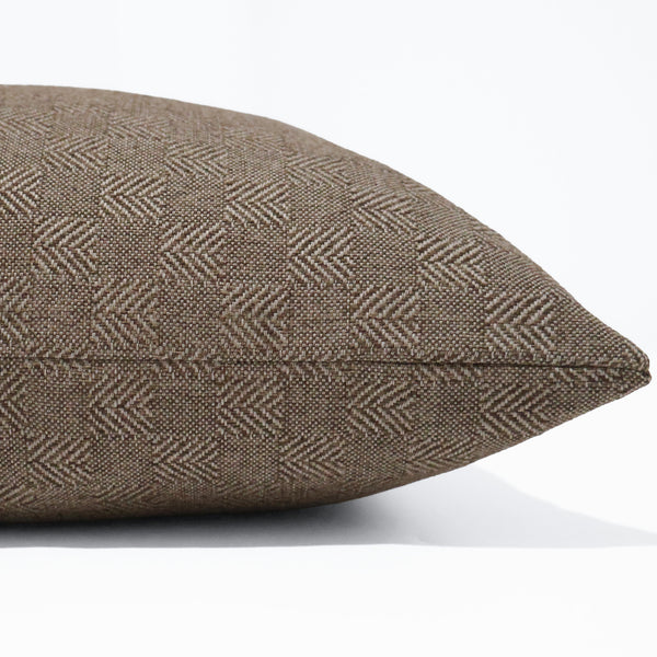 Timber Weave decorative pillow cover handcrafted from premium indoor performance upholstery fabric featuring a rich geometric herringbone-inspired woven texture in warm earthy brown, luxury designer accent pillow for organic modern, transitional, rustic, and contemporary interiors. Side view of cushion cover.