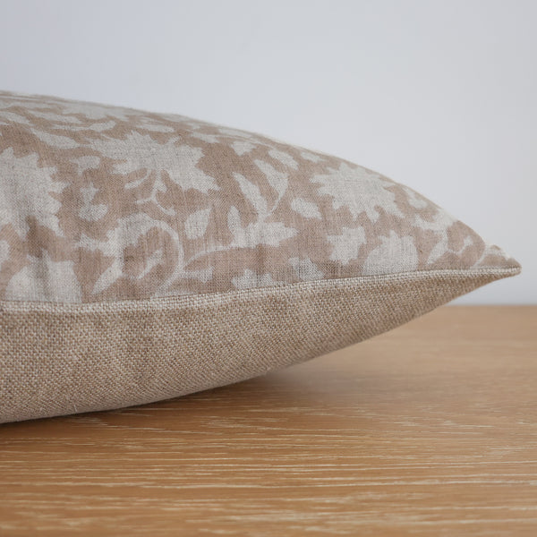 Side view of Whisper Pink Floral Block Print pillow cover by Hackner Home showing the textured weave and stitching detail.