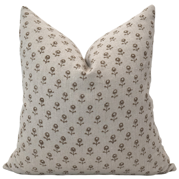 Neutral linen pillow cover featuring a small brown floral block print pattern with a soft, textured finish.