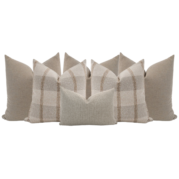 Hackner Home neutral bed pillow set featuring soft beige plaid and textured accent pillows styled for layered bedroom decor.