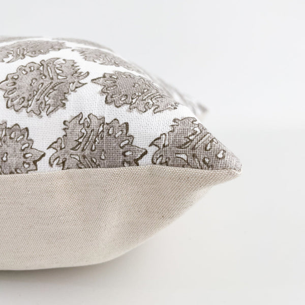 Side view of Hackner Home Belgian Countryside pillow cover showcasing taupe damask block print on white fabric with natural linen backing.