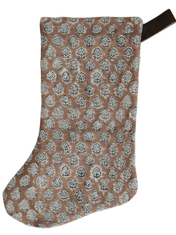 Brick rose block print Christmas stocking featuring a repeating hand-stamped floral motif in white and charcoal with a dark velvet hanging loop.