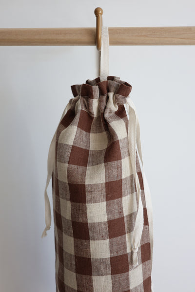 Hackner Home brown gingham fabric grocery bag holder with drawstring ties.