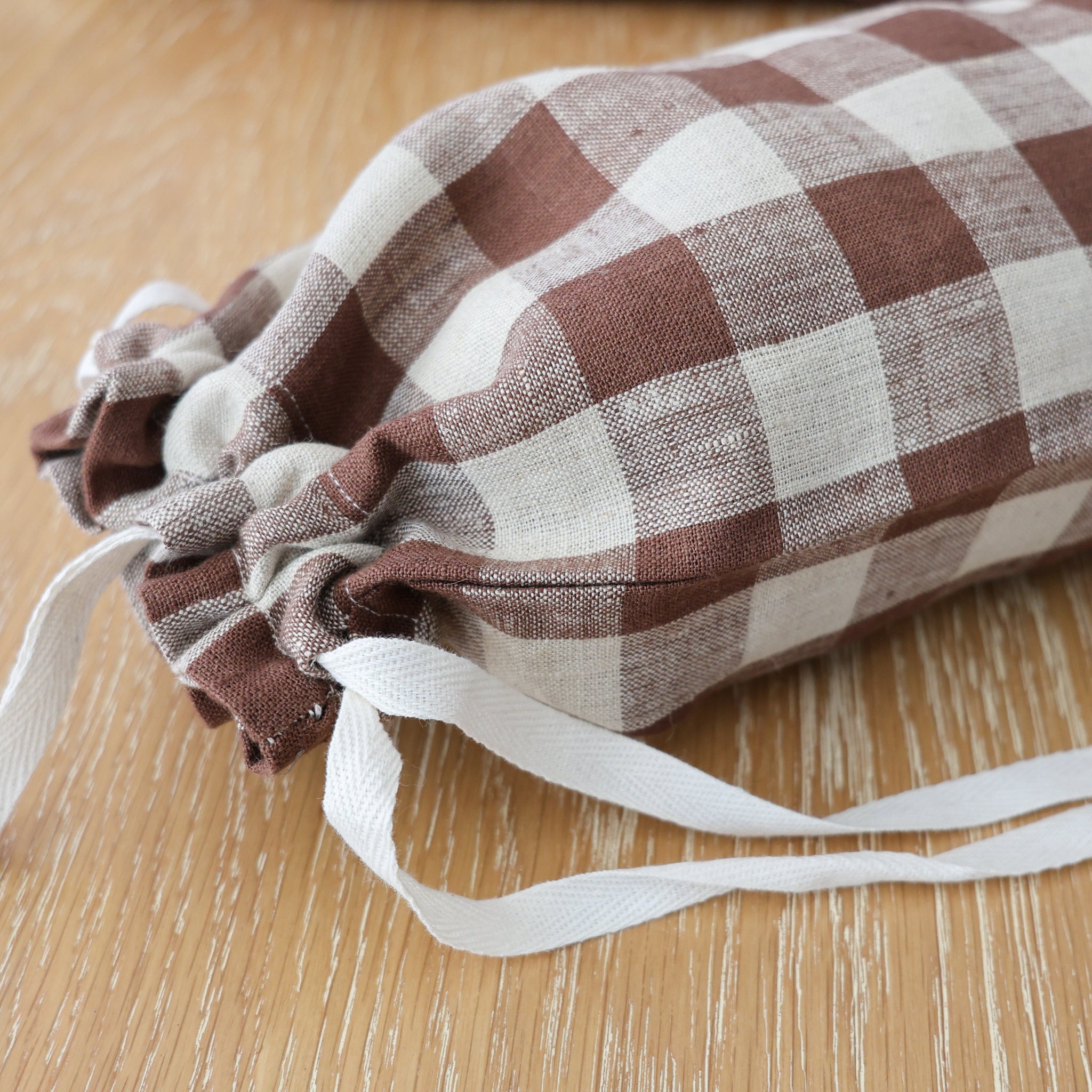 Hackner Home brown gingham fabric grocery bag holder with drawstring ties.