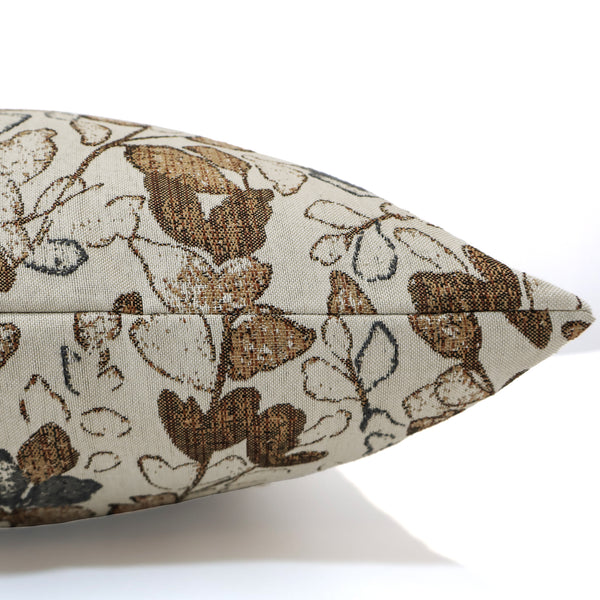 Close-up side view of Hackner Home Cottage Harvest pillow cover showcasing a beige fabric with brown and gray leaf pattern, perfect for rustic or fall-inspired decor.