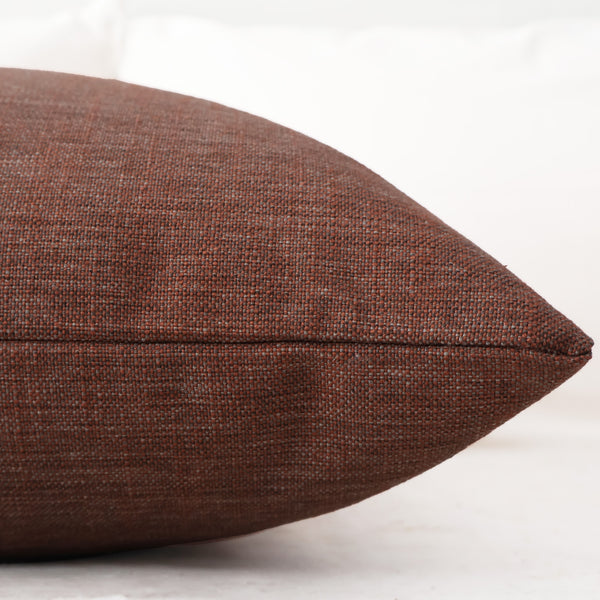 Side view of Desert Blush pillow cover by Hackner Home showing the textured weave and stitching detail.