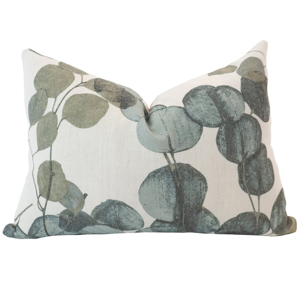 Hackner Home Eucalyptus Leaf lumbar pillow cover featuring a botanical print of soft green and muted blue leaves on a natural cream background.