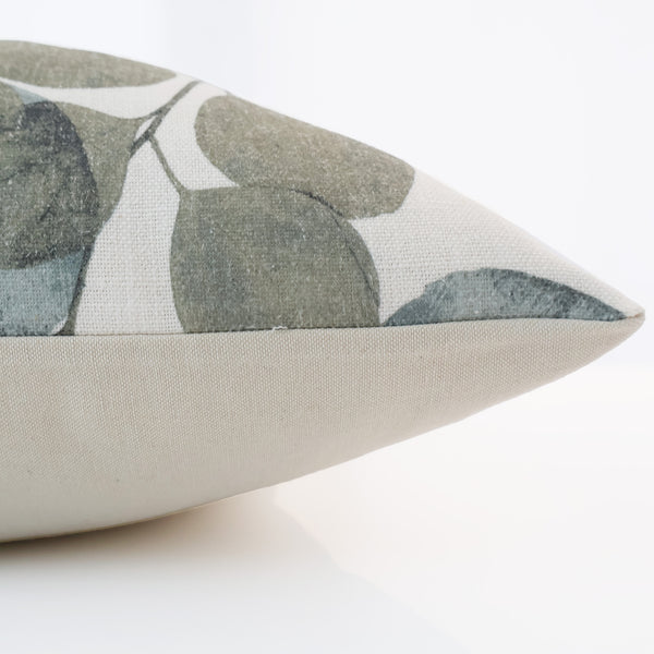 Close-up side view of the Hackner Home Eucalyptus Leaf pillow cover showing the detailed botanical print and neutral linen backing.