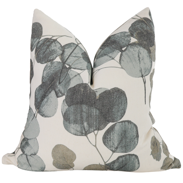 Hackner Home Eucalyptus Leaf pillow cover featuring soft sage, olive, and charcoal botanical print on a neutral cream background.