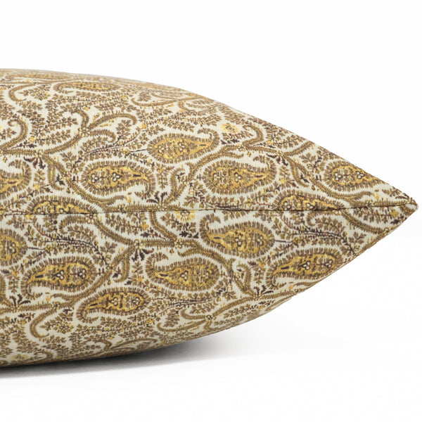 Side view of Hackner Home Fall Paisley pillow cover showcasing the intricate gold and brown paisley pattern on an ivory fabric.