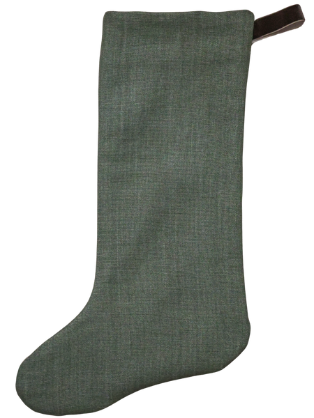 Forest green linen Christmas stocking with a brown velvet hanging loop — elegant and timeless holiday decor by Hackner Home.