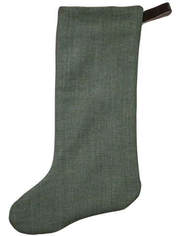 Forest green linen Christmas stocking with a brown velvet hanging loop — elegant and timeless holiday decor by Hackner Home.
