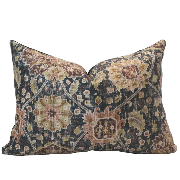 Lumbar pillow with a vintage-inspired medallion and floral pattern in muted tones of gold, blush, olive, and charcoal on soft velvet fabric.