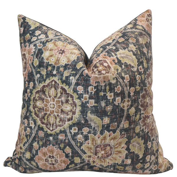 Decorative pillow with an intricate medallion and floral pattern in muted tones of gold, blush, olive, and charcoal on a soft velvet fabric.