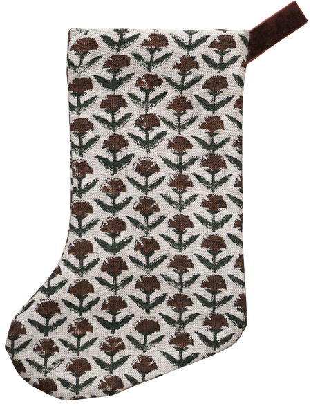 Hackner Home Holly Block Print Boho Christmas Stocking featuring a hand-printed brown and green floral pattern on natural linen with a brown velvet hanging loop.
