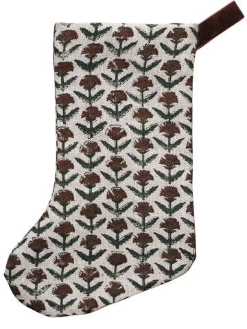 Hackner Home Holly Block Print Boho Christmas Stocking featuring a hand-printed brown and green floral pattern on natural linen with a brown velvet hanging loop.