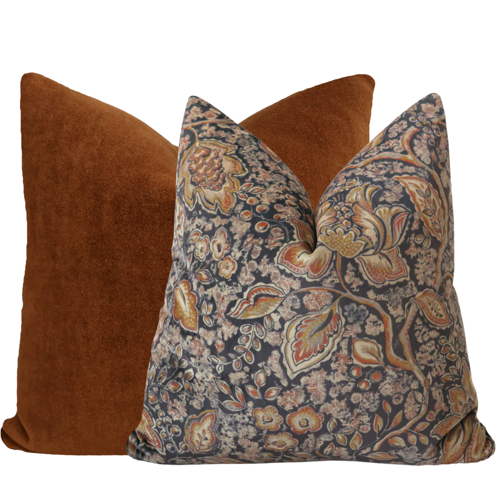 Hackner Home Luxurious Textures Pillow Cover Set featuring a rich burnt orange velvet pillow paired with a navy floral pillow accented with warm autumn tones.