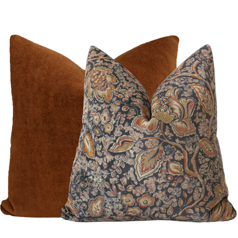 Hackner Home Luxurious Textures Pillow Cover Set featuring a rich burnt orange velvet pillow paired with a navy floral pillow accented with warm autumn tones.