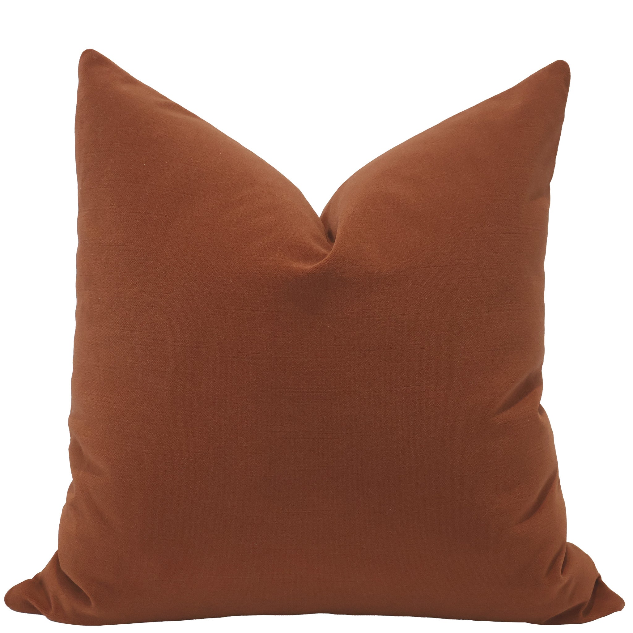 Front view of a pumpkin orange velvet pillow cover with a smooth, soft texture and plush tailored shape.
