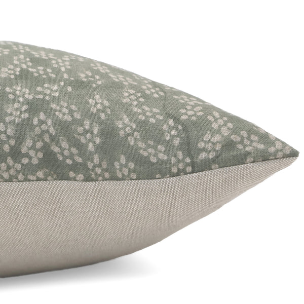 Side view of Hackner Home Sage Green Floral Block Print pillow cover with ivory botanical pattern and neutral beige linen back.