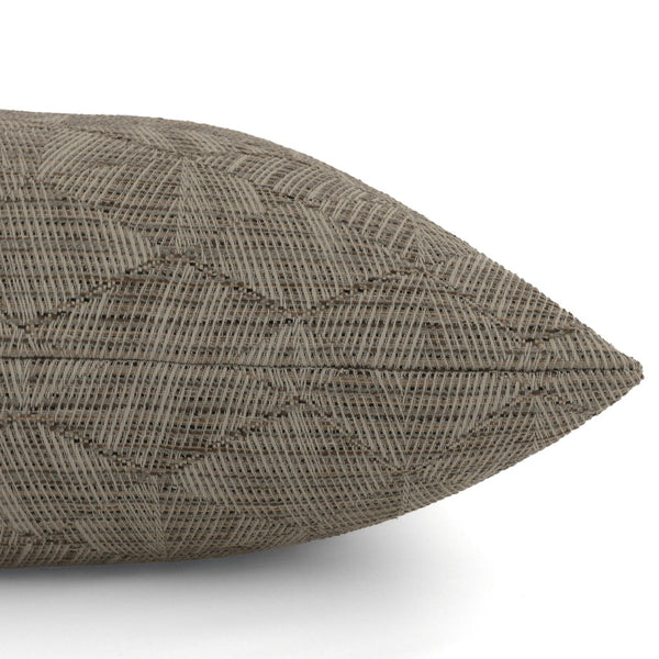 Close-up side view of Hackner Home Sand Petal outdoor pillow cover featuring geometric woven pattern in taupe brown outdoor fabric.