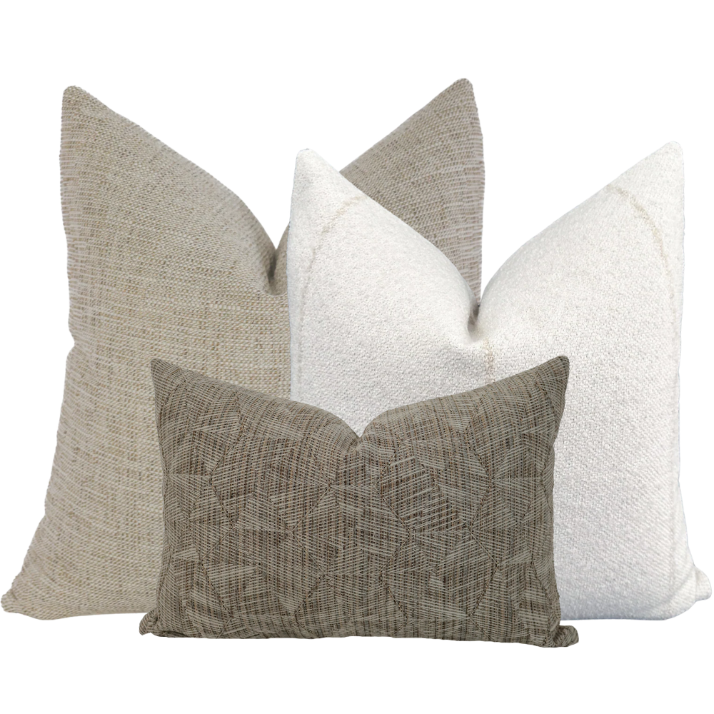Hackner Home Sand Petal outdoor pillow cover set featuring neutral textured fabrics in tan, cream, and taupe tones, styled for a modern, natural outdoor look
