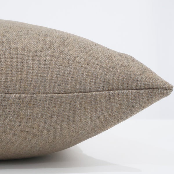 Hackner Home Simply Neutral Wool pillow cover side view showcasing soft beige wool texture and high-quality woven fabric.